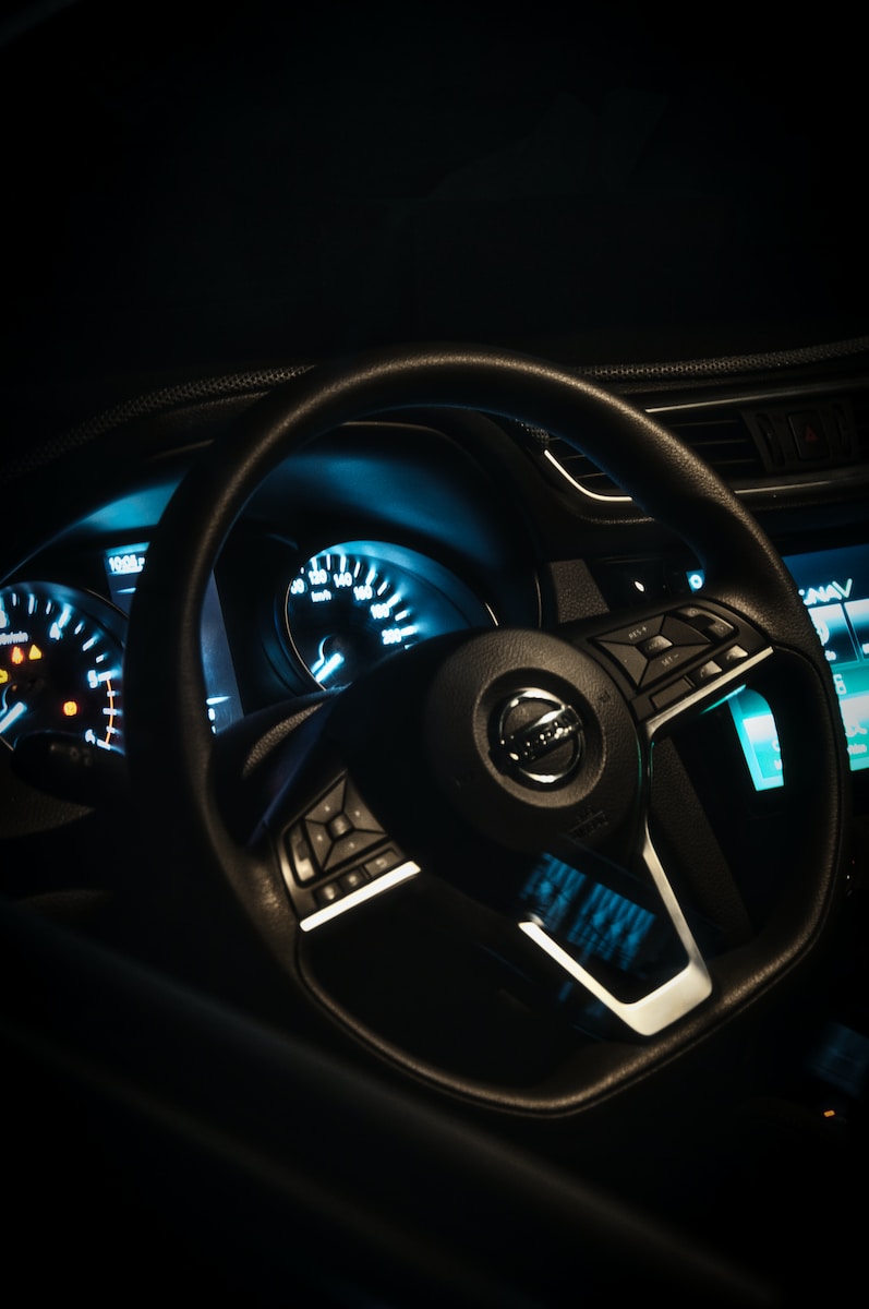 a steering wheel and dashboard of a car