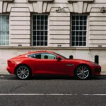 red coupe during daytime