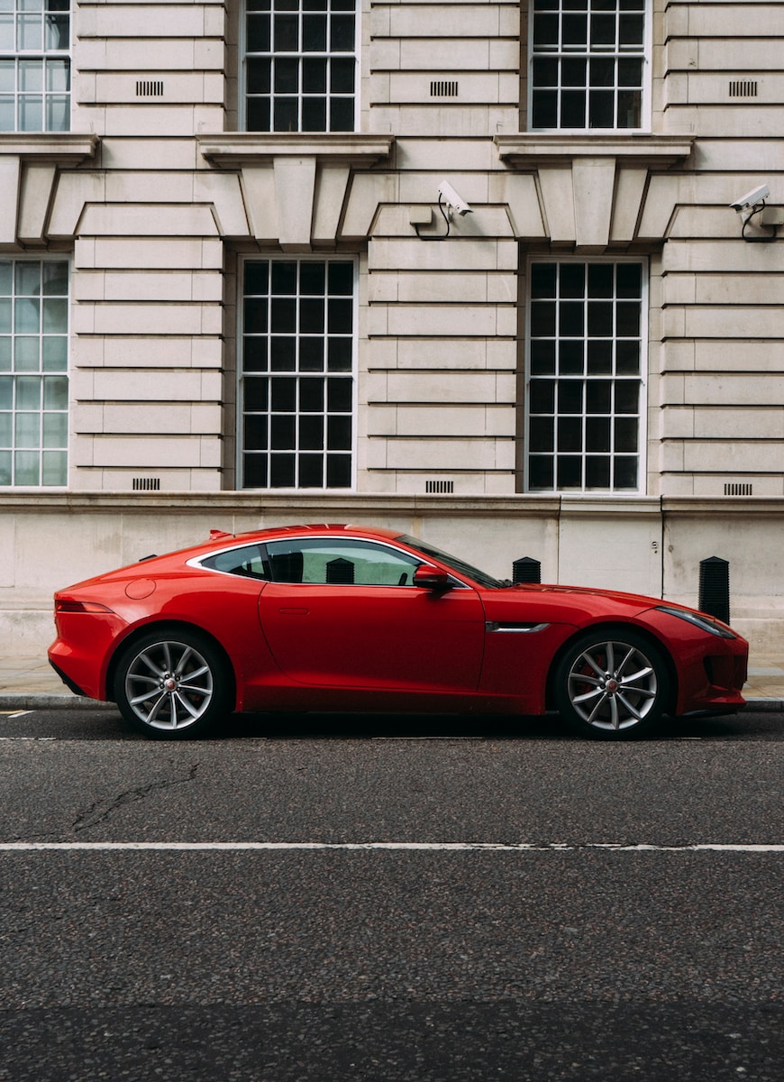 red coupe during daytime