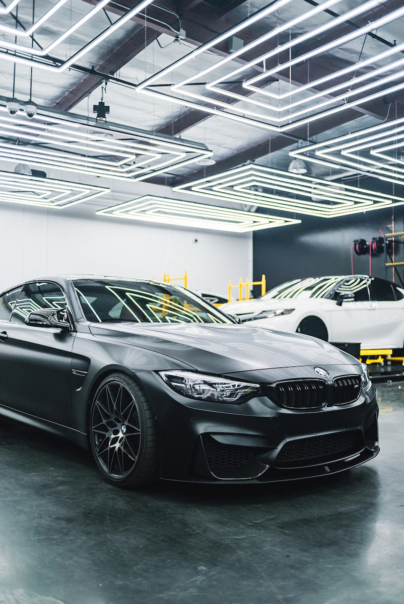 Contemporary black automobile standing in garage