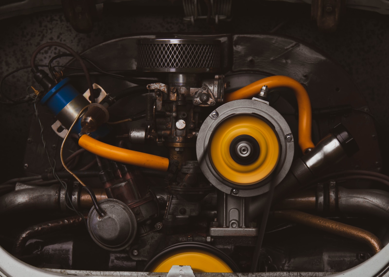 a close up of a car engine with yellow hoses