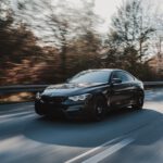 black coupe on road