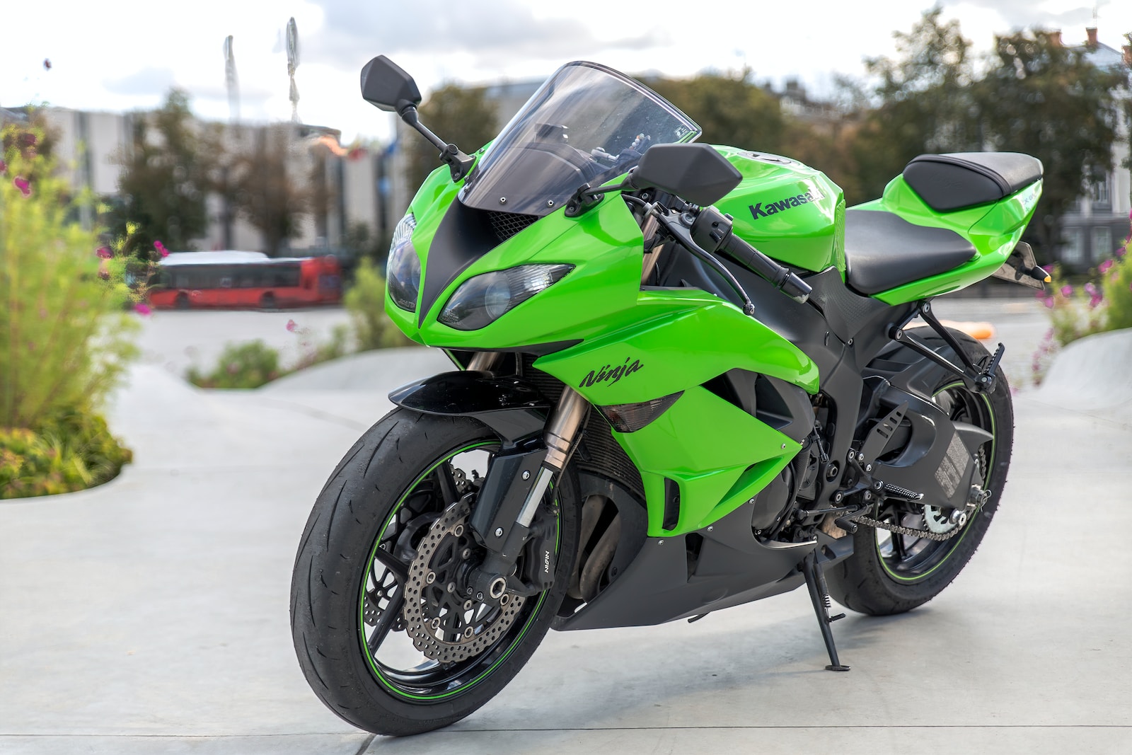 green and black sports bike