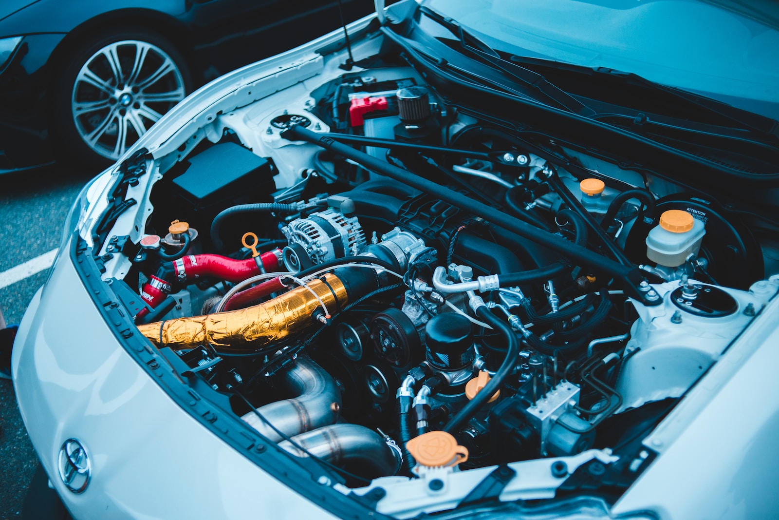 blue and white car engine bay