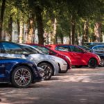 blue and red sports car on road during daytime