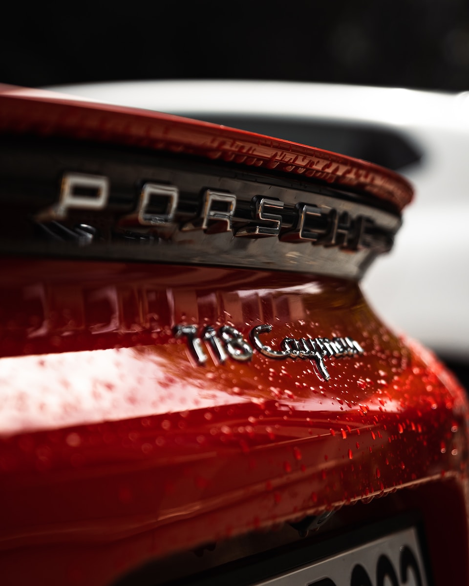 a close up of the emblem on a red car