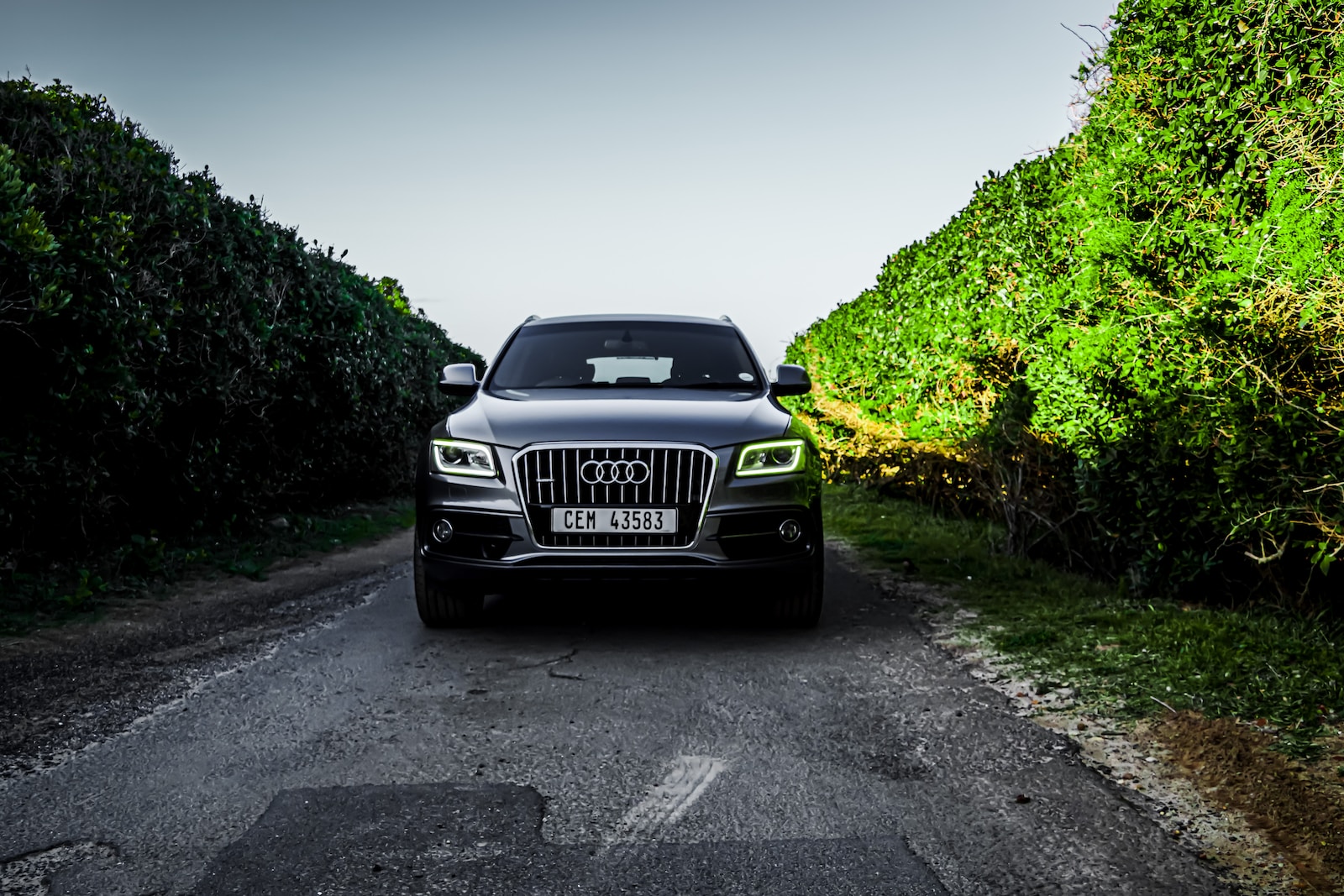 black bmw car on road during daytime