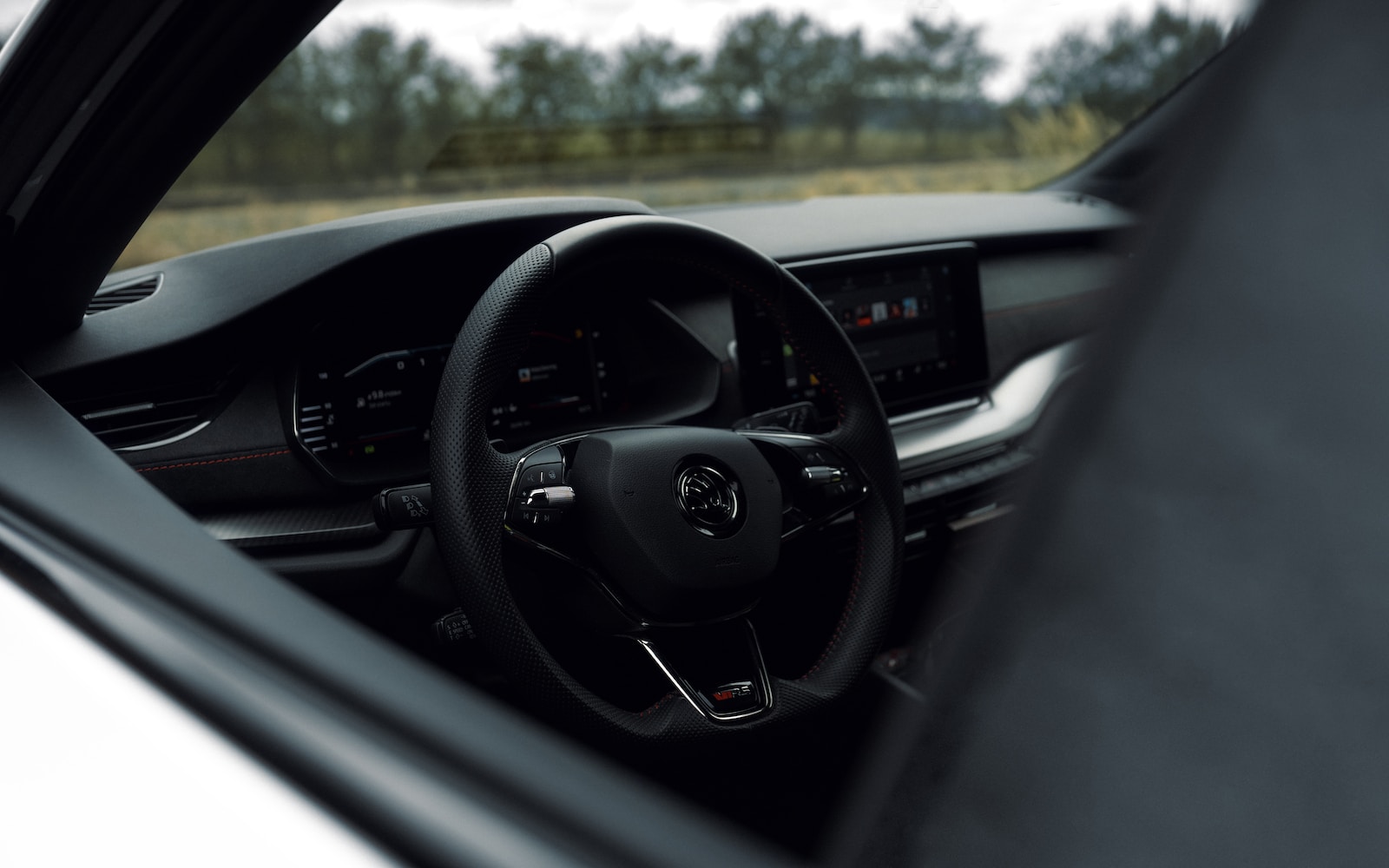 a car's dashboard and steering wheel