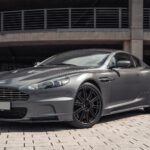 grey mercedes benz coupe parked on grey concrete pavement during daytime