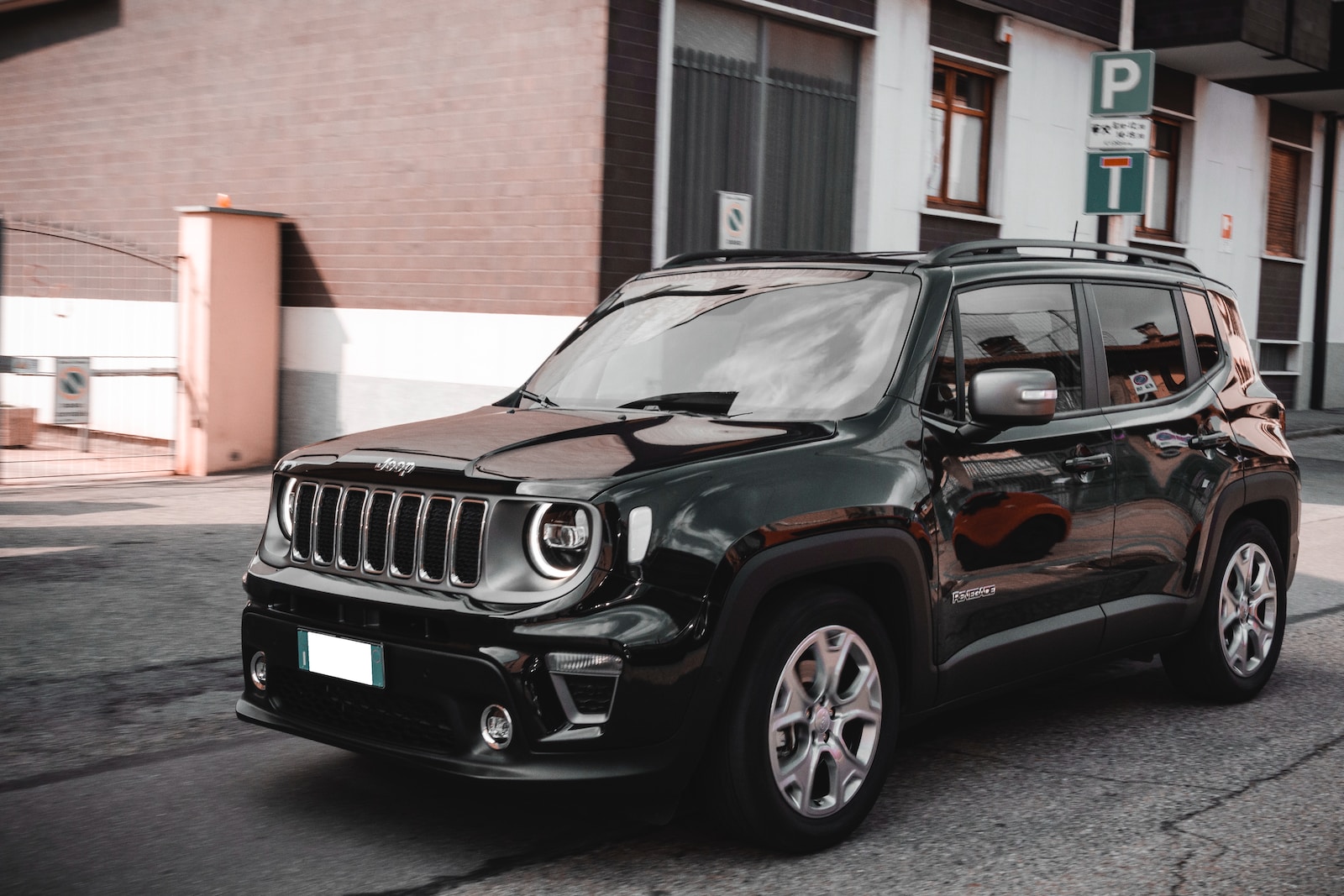 a black jeep parked on the side of the road