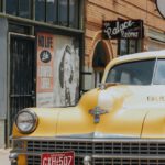 yellow vehicle parked next to building