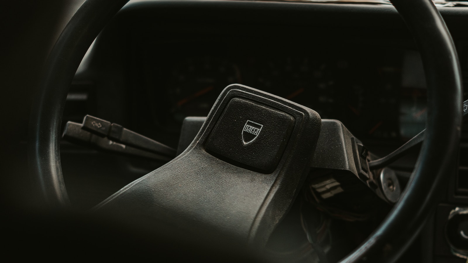 black honda steering wheel in close up photography