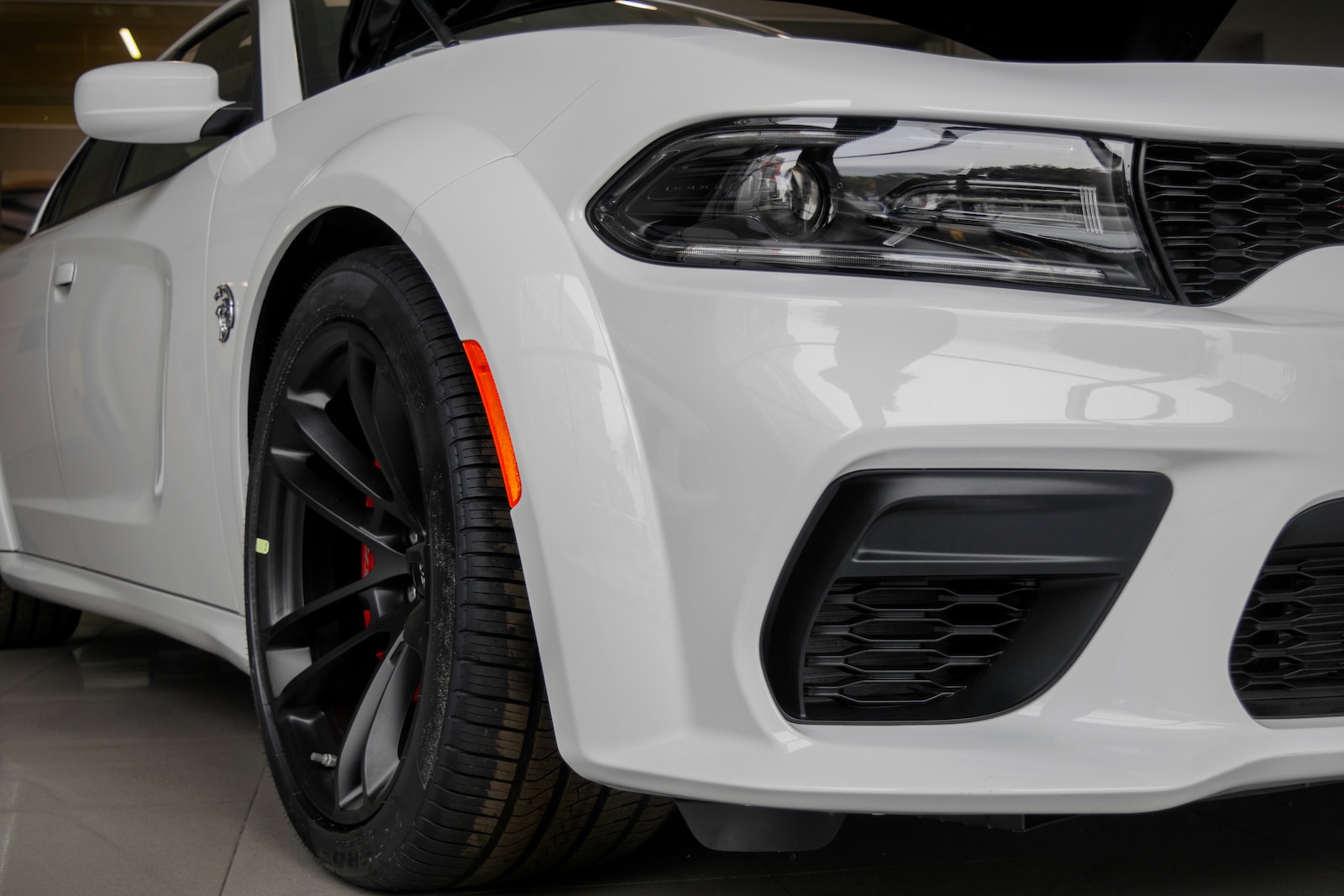 a white car with black rims