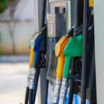 a row of gas pumps filled with gas