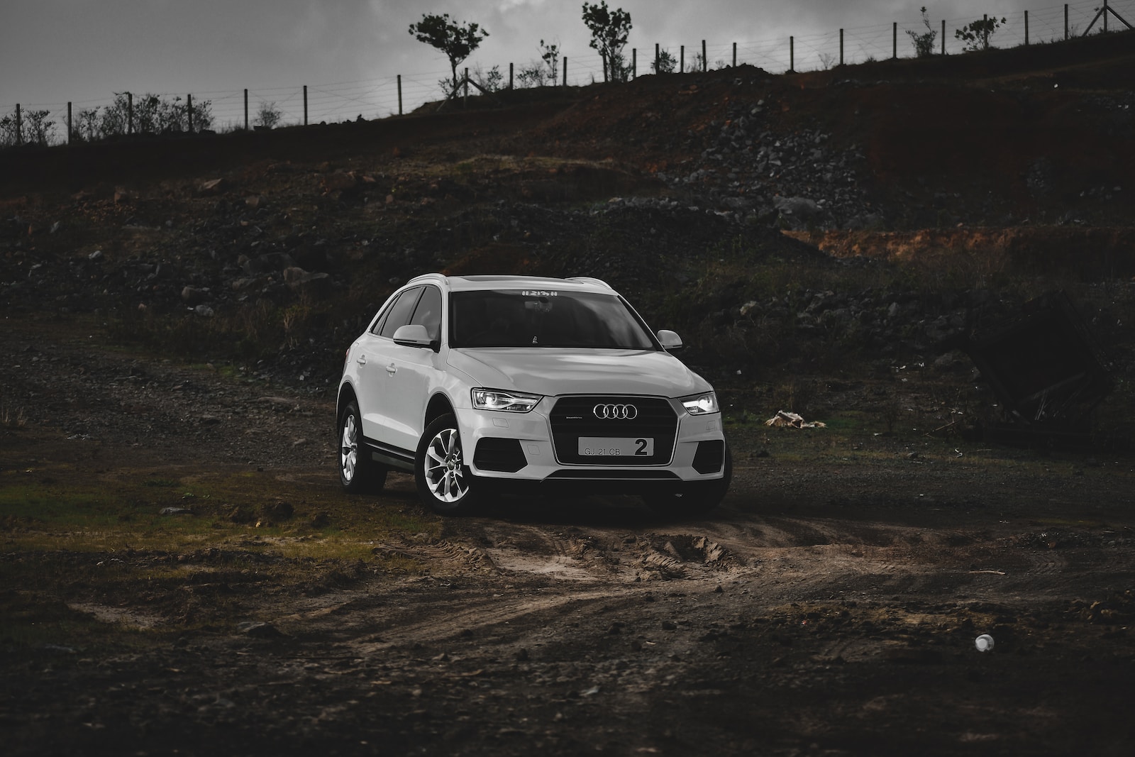 white bmw m 3 on dirt road