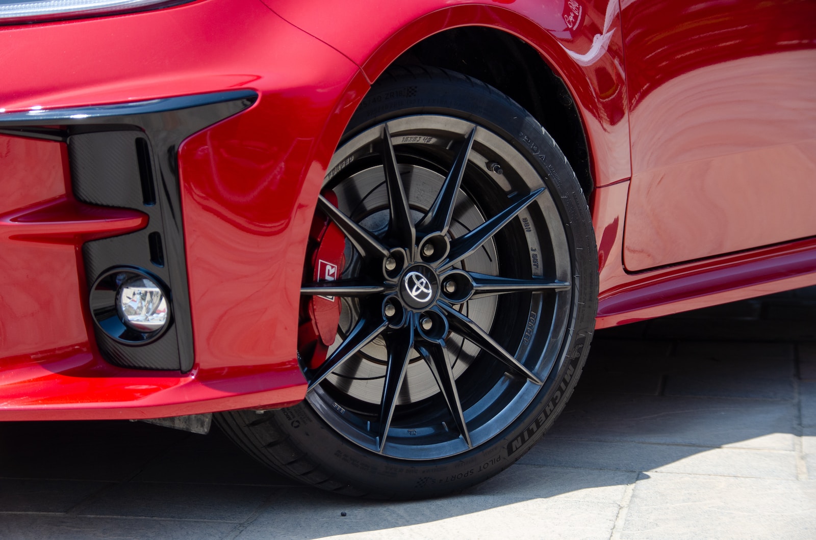 a red car with a black rim