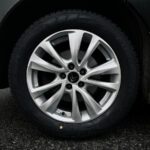 silver 5 spoke wheel with tire