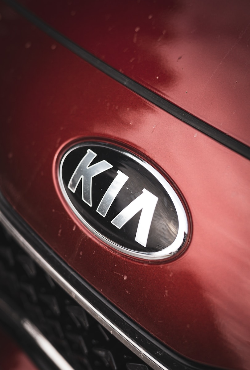 a close up of the emblem on a red car