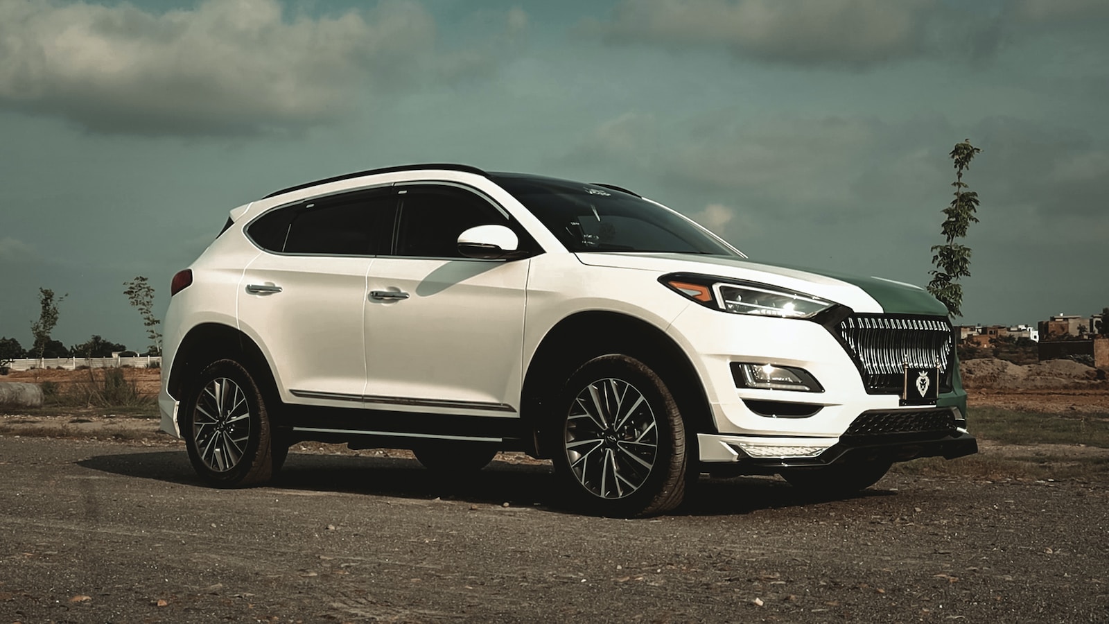 white honda car on gray asphalt road