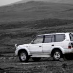 white suv on dirt road