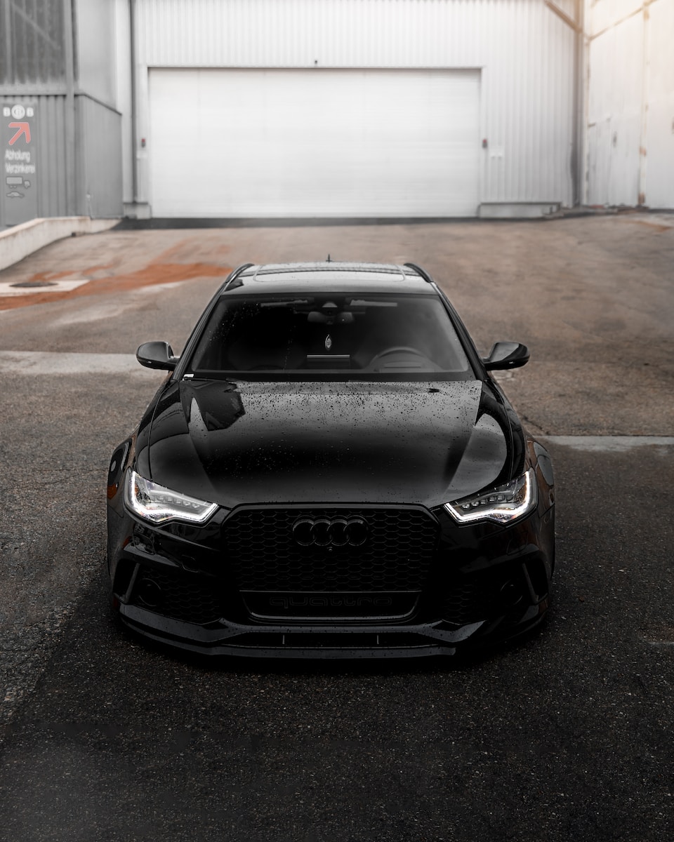 black bmw m 3 parked on parking lot during daytime