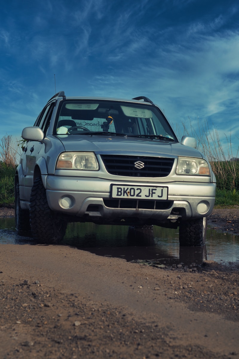 a car parked in a muddy area