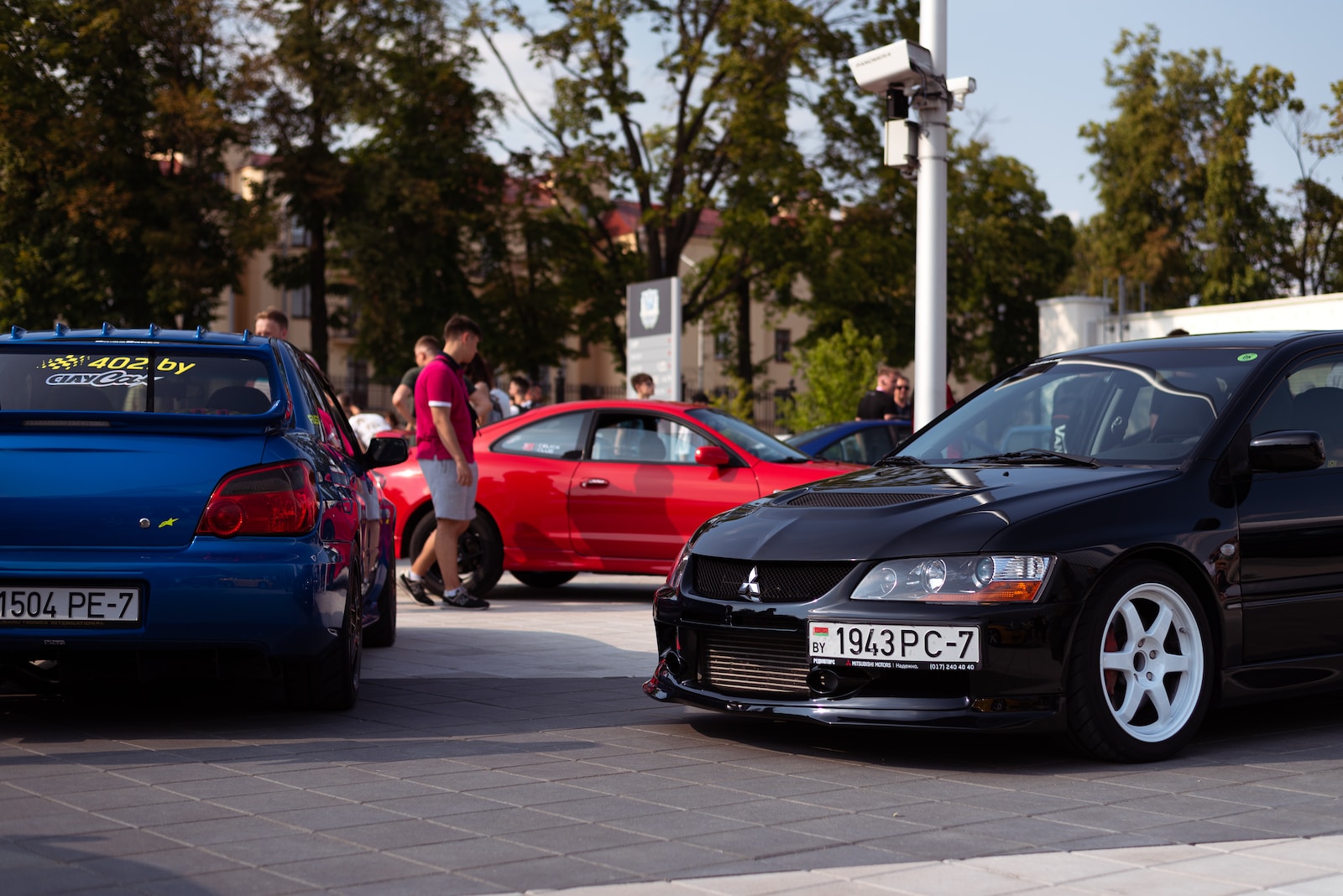 a group of cars parked on the side of a road