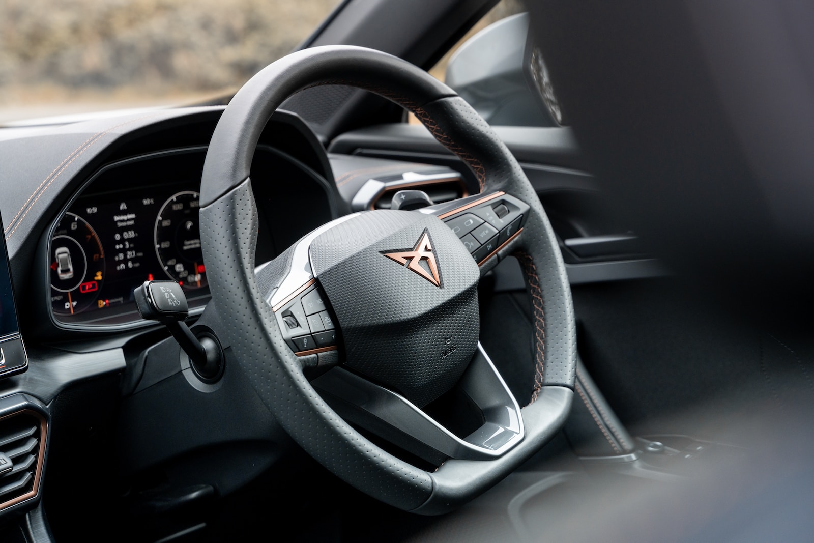 the steering wheel and dashboard of a car