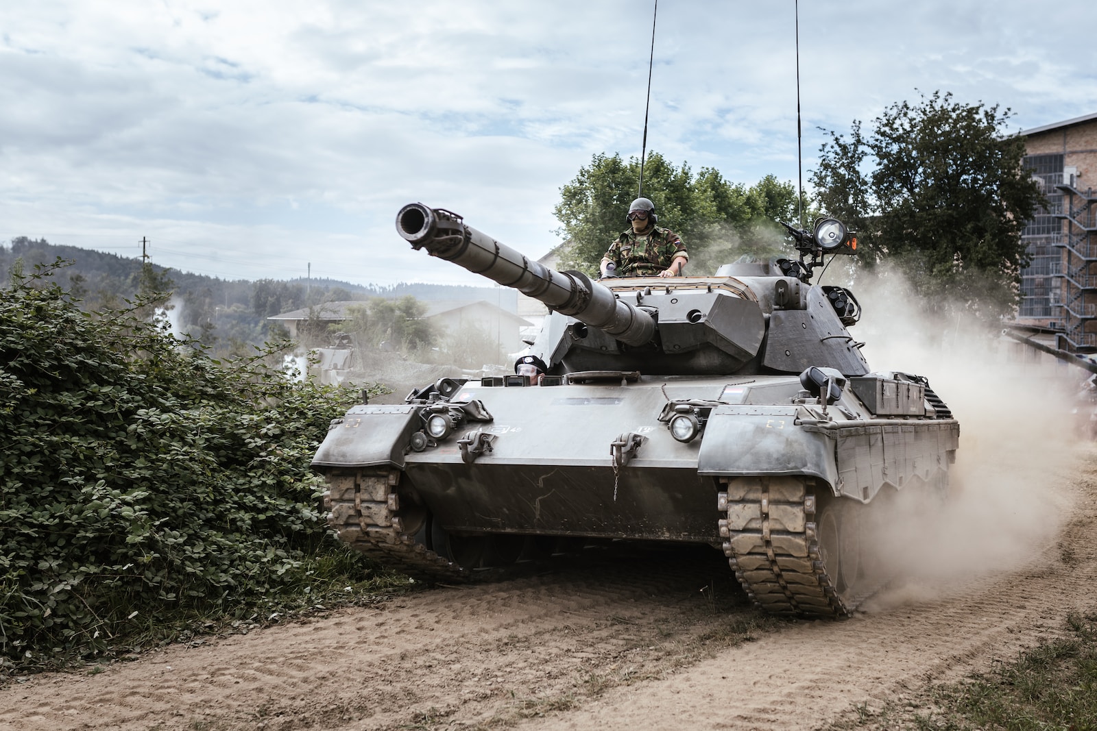 battle tank on green grass field during daytime