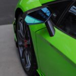 green and black car on road during daytime