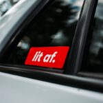 a red sticker that says it's off on the side of a car