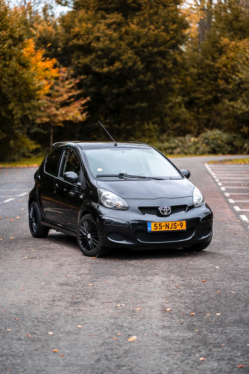 black honda sedan on road during daytime