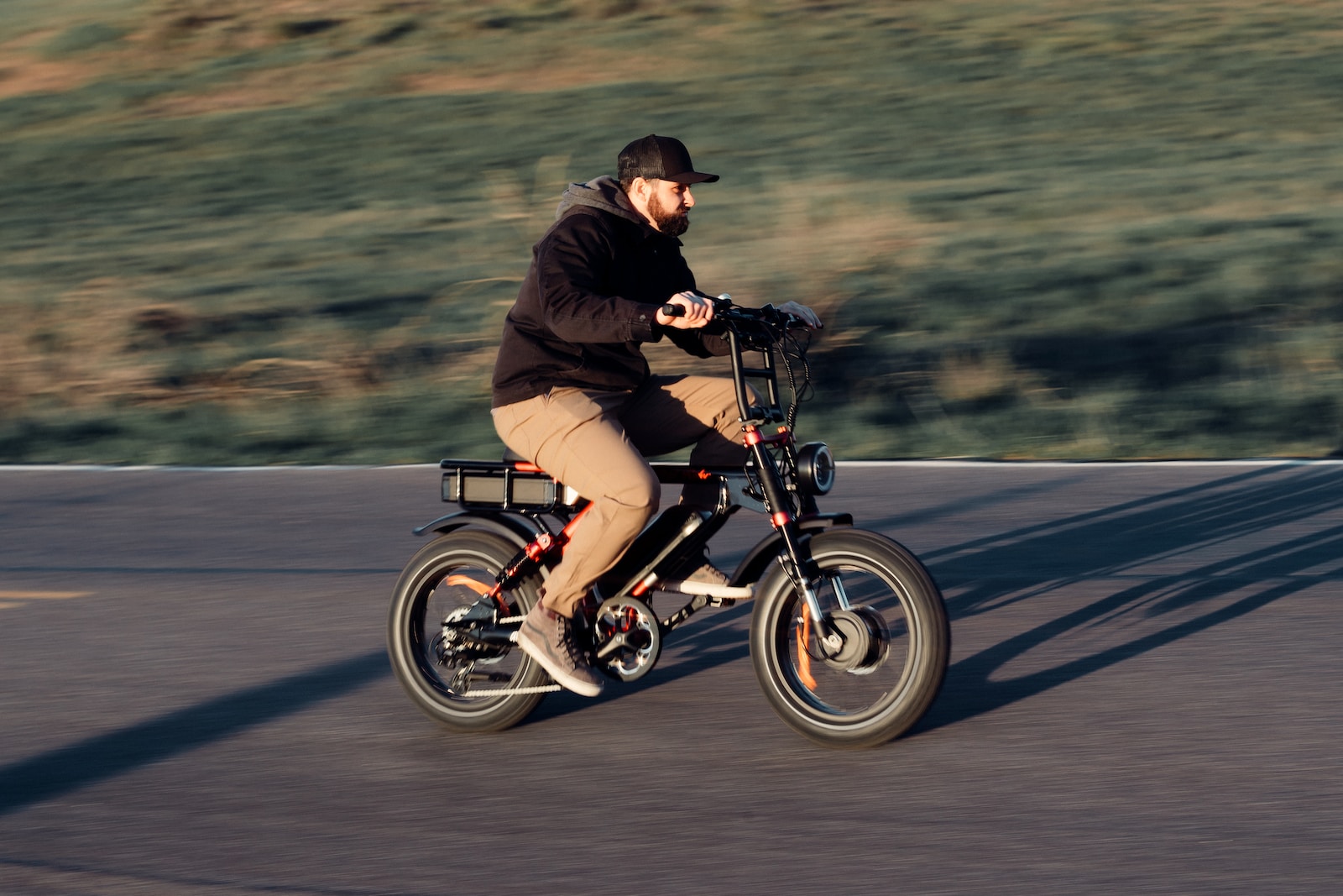 a man riding a bike down a street