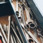 a bunch of wrenches and other tools in a box