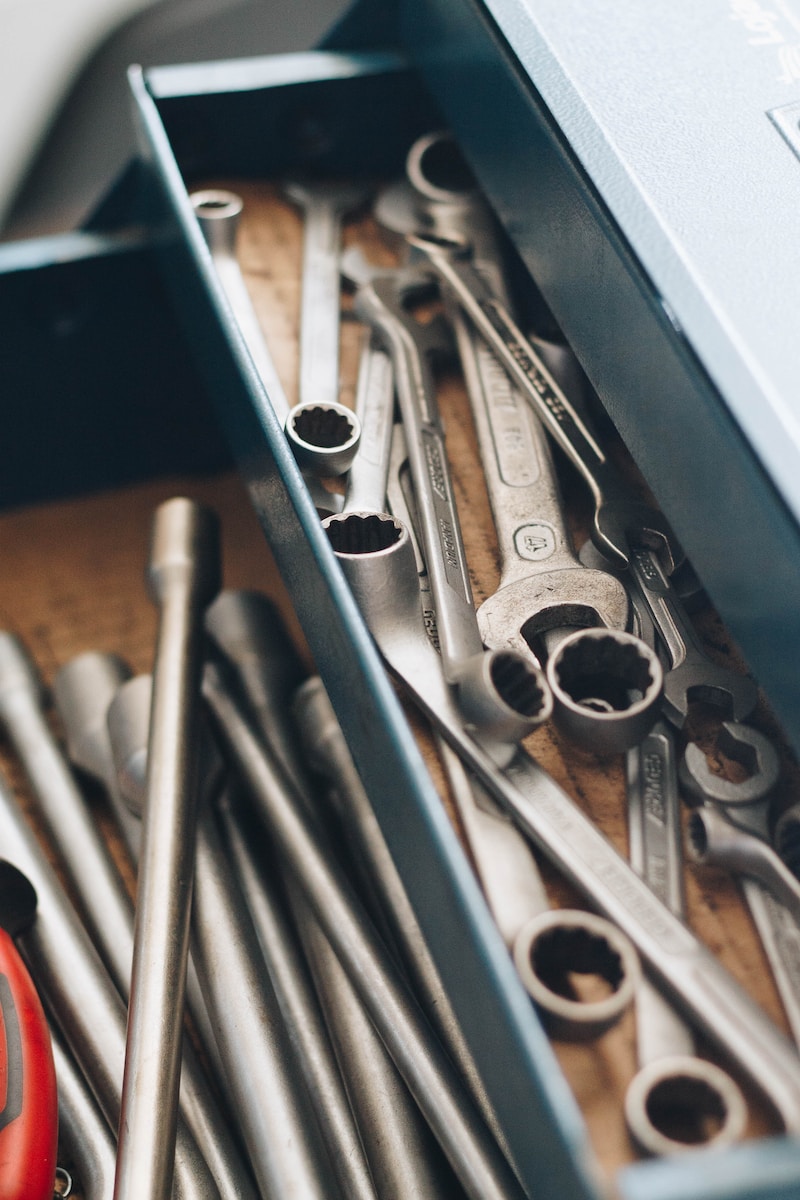 a bunch of wrenches and other tools in a box