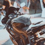 black and brown motorcycle parked on the street during daytime