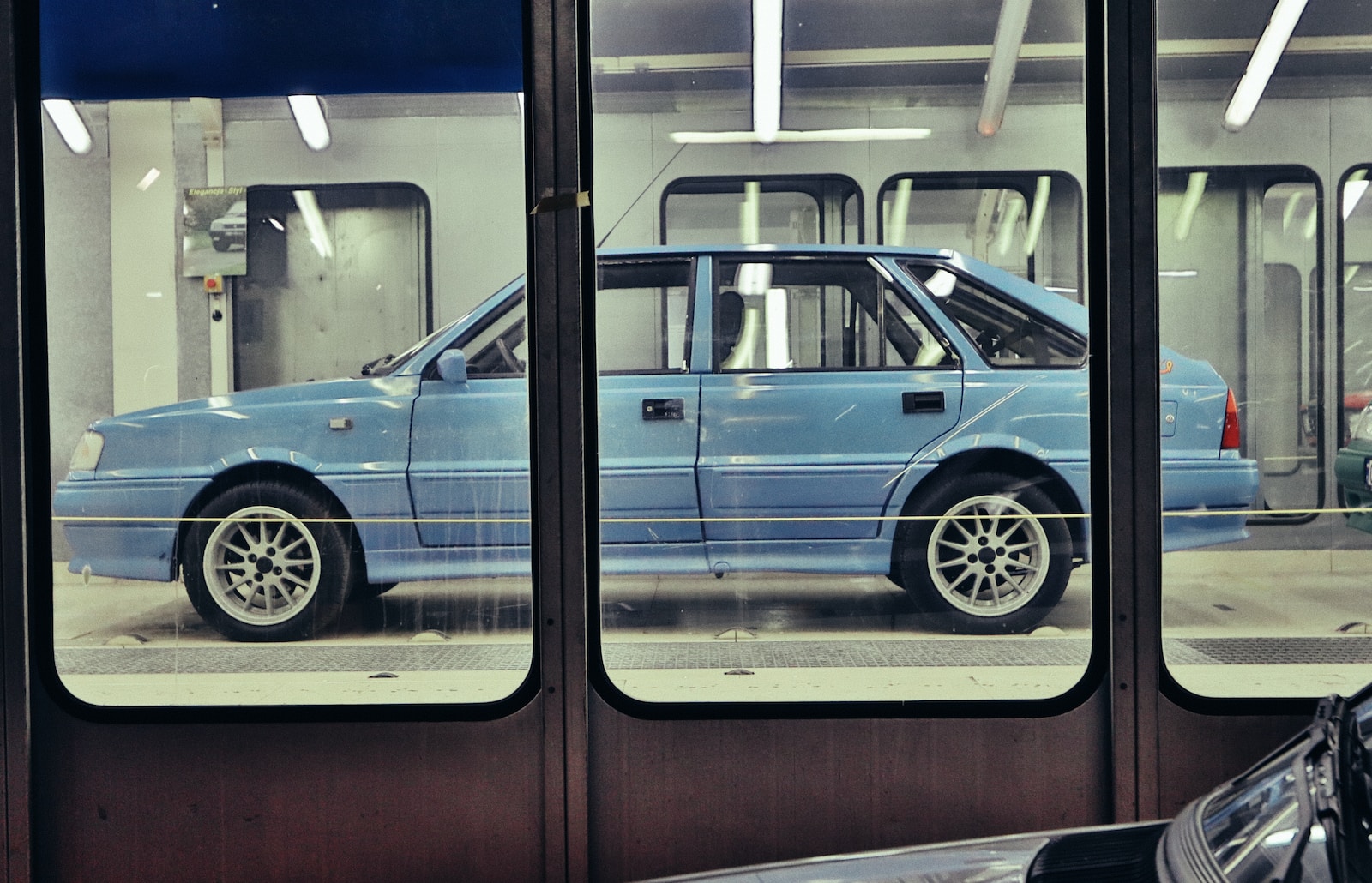 blue car in a parking lot