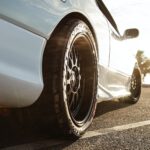 white car parked on road during day