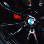 black BMW 5-spoke vehicle wheel with tire