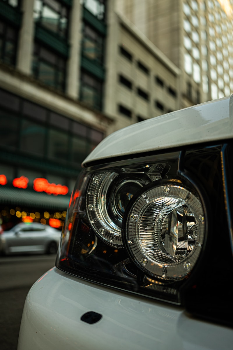 black car with white and orange lights on during daytime