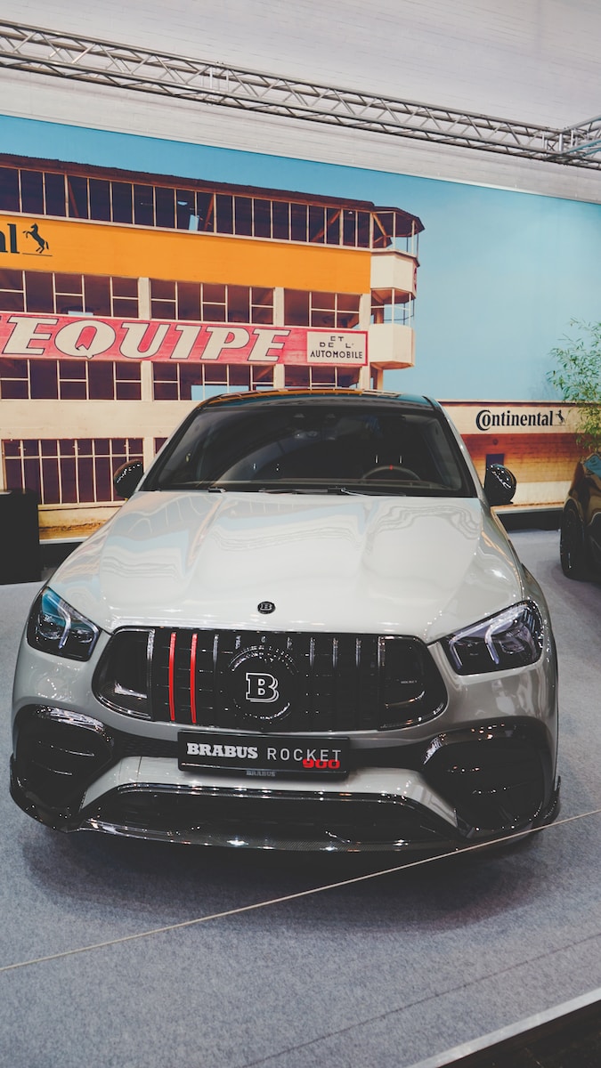 a white car parked in front of a building