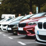 white and red bmw m 3 on road during daytime