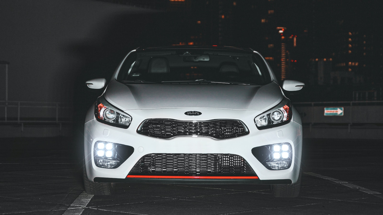 white mercedes benz car with lights on during night time