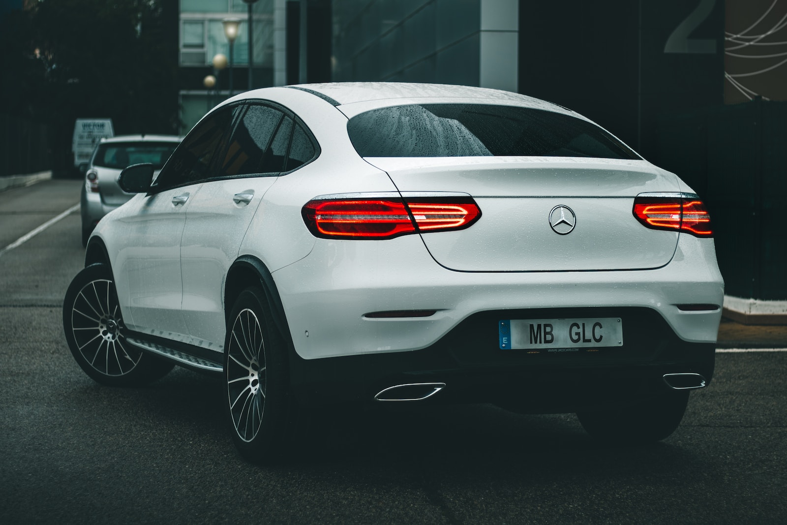 silver bmw x 6 parked on gray concrete floor