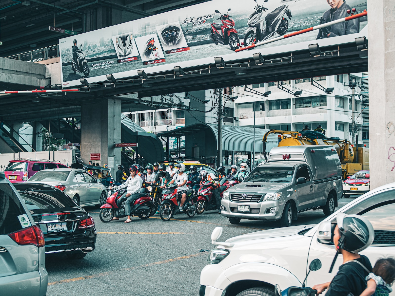 people riding motorcycle on road during daytime